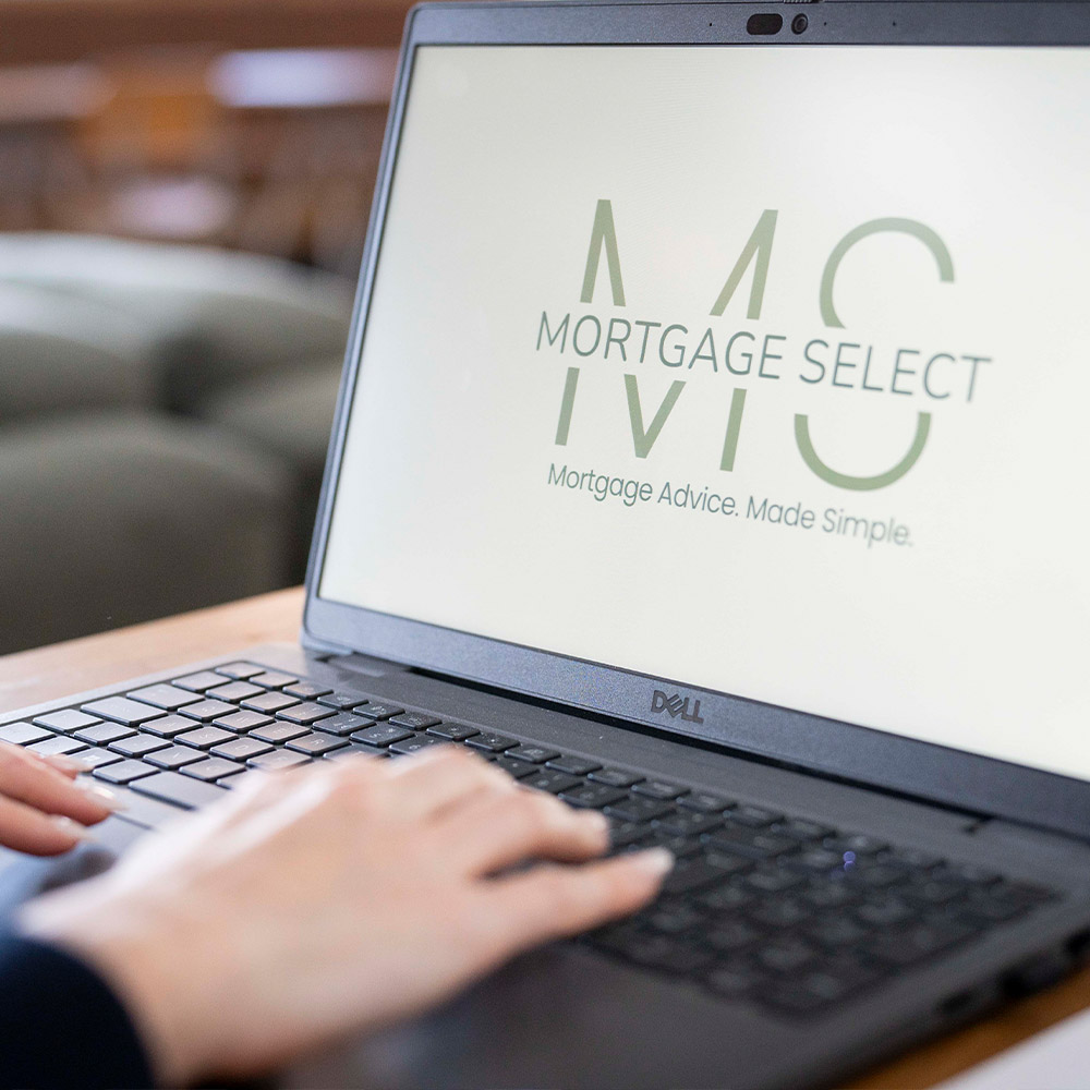 A laptop with the Mortgage Select logo on it